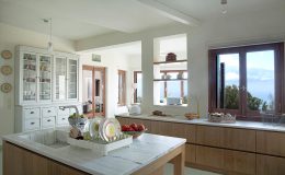 Spacious open planned kitchen with a central island and casual breakfast bar.